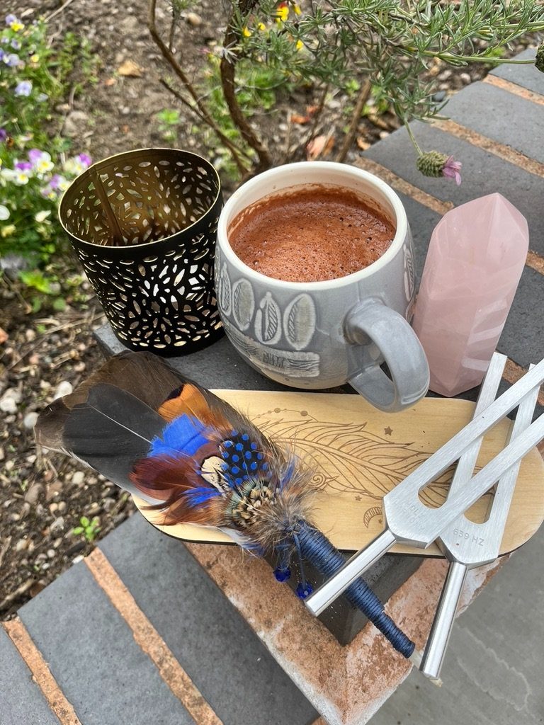 Cacao, tuning forks and crystals laid out before a ceremony